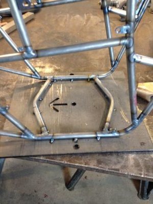 Chassis top loop in welding fixture